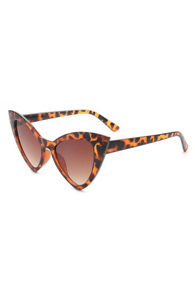 angular cat-eye plastic frame sunglasses in a translucent tortoiseshell pattern with gradient brown lens, shown 3/4 view