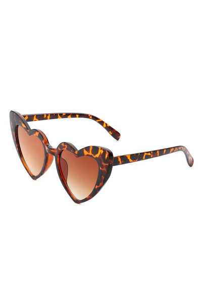 angular cat eye "Lolita" heart-shaped sunglasses in a translucent tortoiseshell pattern with brown gradient lens, shown 3/4 view