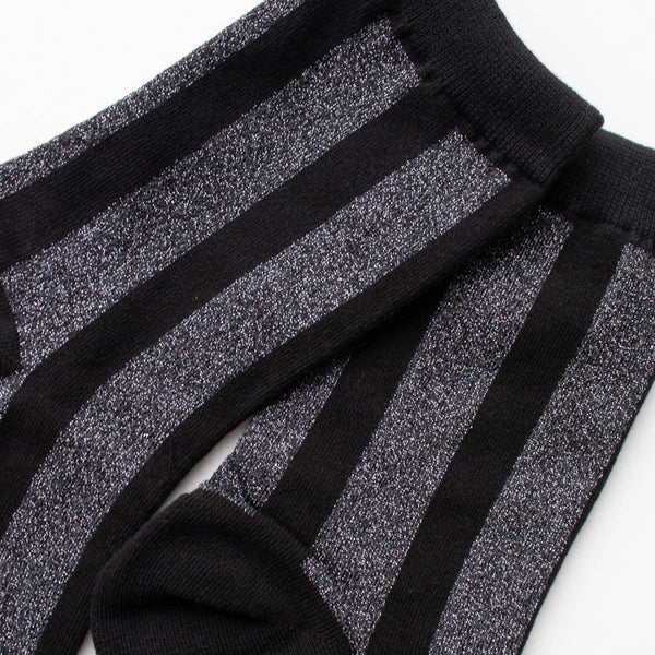 cotton knit crew socks in black with a sleek charcoal grey lurex vertical stripe pattern. Shown in close up