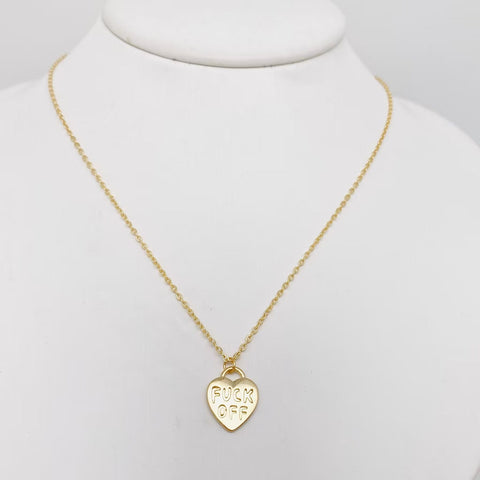 Heart-shaped pendant in gold metal engraved with “FUCK OFF” on a matching link style chain