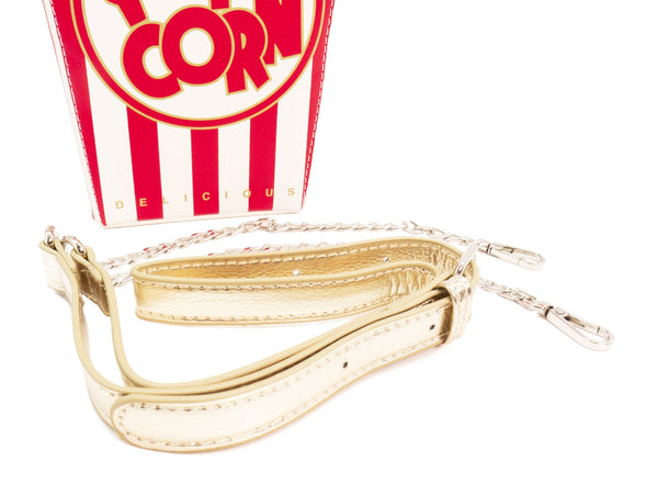 Novelty purse in the shape of a box of red and white striped popcorn. Shown with gold lamé crossbody strap 