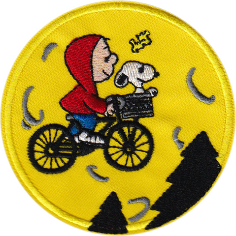 Bright yellow twill embroidered patch of Charlie Brown dressed like Elliott from the movie E.T. with Snoopy in his bike basket recreating the flying bike scene from the movie