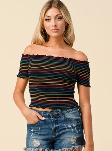 A model wearing a off-the-shoulder crop top in classic black with all-over rainbow stripe smocking and slightly ruffled edges