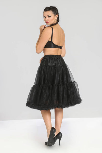 Model wearing a black crinoline with an elasticized waistband. Shown from the back