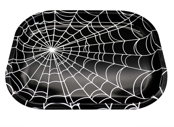 Rectangular tin tray with a wide lip. It has an all-over white spiderweb design on a black background. Shown from an angle in close up to show depth