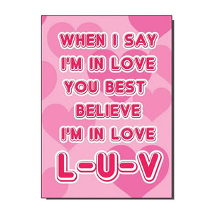 A note card with a pink heart background and the message “When I say I’m in love you best believe I’m in love L-U-V” in white and pink bubble lettering