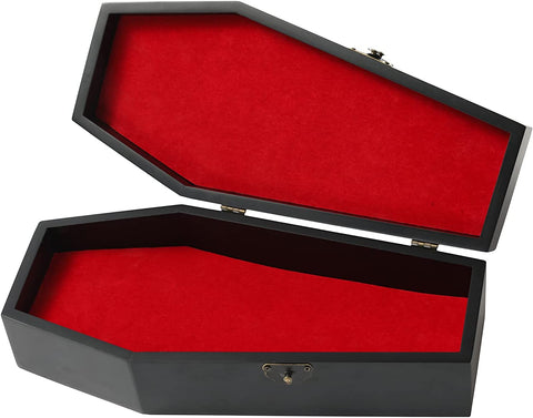 A black coffin shaped hinged trinket box lined with red velvety fabric on both interior sides. Shown open