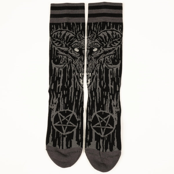  black and grey illustration of a demon with large matching pentagrams on soft black stretch cotton blend crew socks. Shown flat to display matching image on both socks