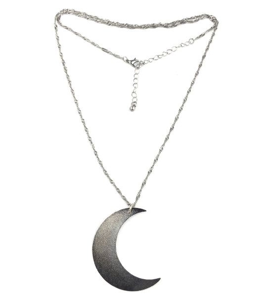 26” shiny silver metal fancy link style necklace with a large silver metal crescent moon pendant. Shown with chain