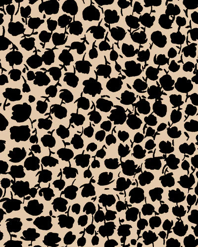 Pattern of black ditsy flowers with leaves and stems on a tan background 