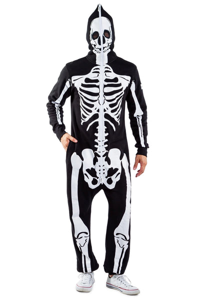A male model wearing a black lightweight fleece zip-up jumpsuit with an all-over anatomical skeleton screen printed motif. The zipper runs to the top of the hood and it has two mesh covered eye holes. Seen from the front fully zipped with hood up