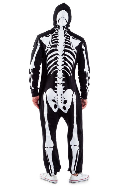 A male model wearing a black lightweight fleece zip-up jumpsuit with an all-over anatomical skeleton screen printed motif. The zipper runs to the top of the hood and it has two mesh covered eye holes. Seen from the back with hood up