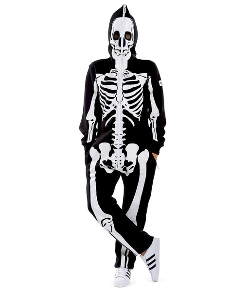 A female model wearing a black lightweight fleece zip-up jumpsuit with an all-over anatomical skeleton screen printed motif. The zipper runs to the top of the hood and it has two mesh covered eye holes. Seen from the front fully zipped with hood up