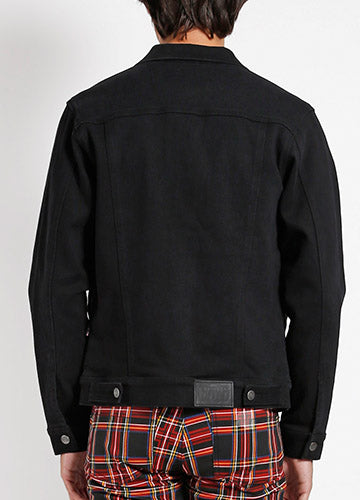 Model wearing men’s black denim jacket. Shown from the back 