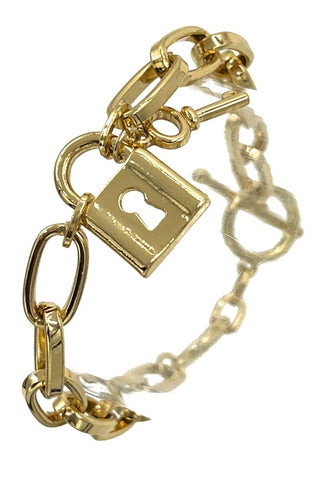 Gold metal link chain toggle bracelet with lock and key charm