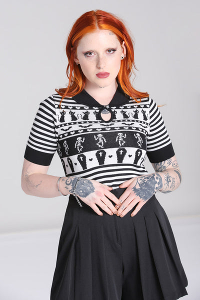 A model wearing a black and white striped short sleeve sweater with a black Peter Pan collar with keyhole and Fair Isle style pattern of black cats, hearts, skeletons, and coffins. Shown from front