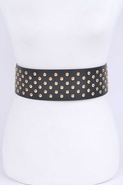 A black faux leather waist belt covered with gold metal round studs. Shown from front on dress form