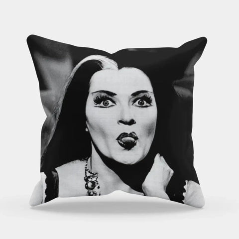 Square pillow with printed black and white photo of Yvonne De Carlo as Lily Munster sticking out her tongue