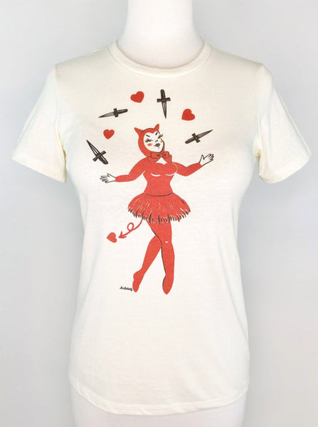 fitted off white t shirt with a print of a pinup-style devil girl juggling black daggers and red hearts shown on a dress form