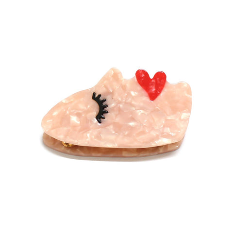 Acetate lady face shaped claw clip with red lips, beige skin, and close eyes