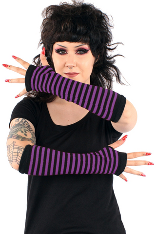 Model wearing purple and black striped arm warmers 