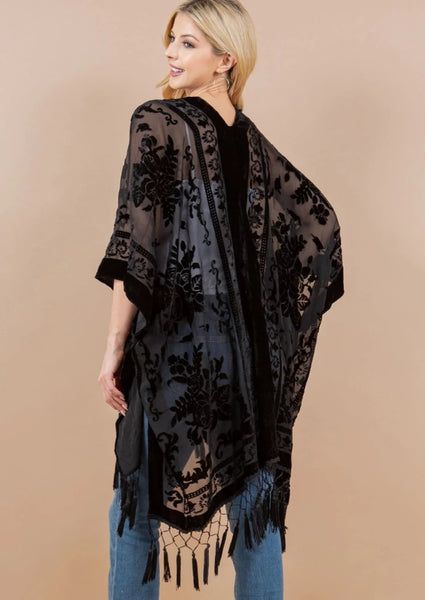 black burnout velvet rose patterned sheer cover-up/robe with an open front and black fringe detail at the hem, shown back view on a model