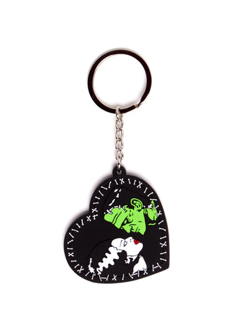 "We Belong Dead" split-ring keychain with 2" heart-shaped embossed rubber mold fob depicting the profile poses of Boris Karloff as the monster and Elsa Lanchester as his mate from the classic 1935 movie, Bride of Frankenstein