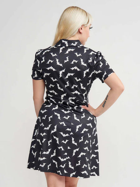 black with allover white bats print short sleeve collared Rosie Dress three button closure bodice, above the knee length a-line silhouette, shown back view on model