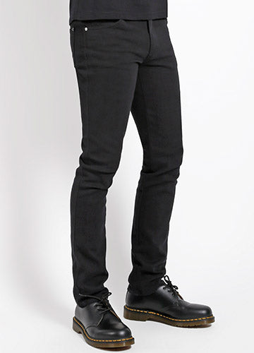 guy's sizing five pocket black stretch denim jeans, shown waist down 3/4 view on a model