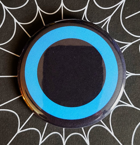 1.25” round button of blue Germs band symbol on a black background 