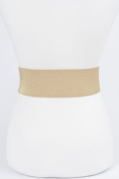 Shiny metallic gold elastic waist belt with self angled buckle. Shown from back