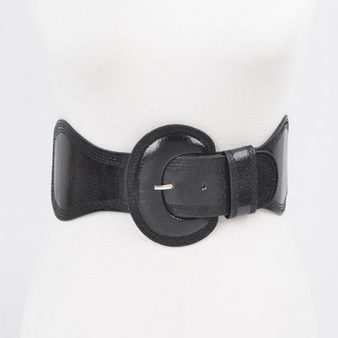 Shiny black faux leather elastic waist belt with self angled buckle. Shown from front 