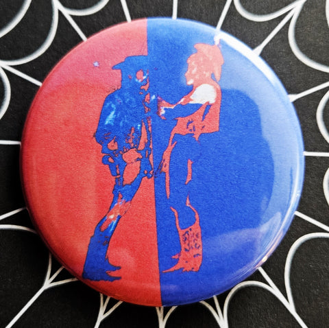 2.25” round button with fetish cowboy art in bright red and blue 