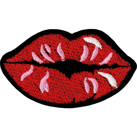 Red lips with white and pink accents embroidered patch on a black felt background 