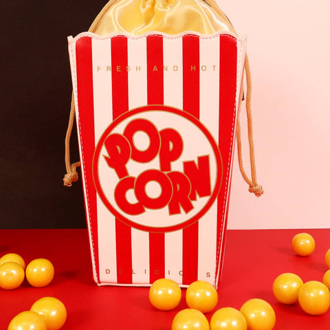 Novelty purse in the shape of a box of red and white striped popcorn