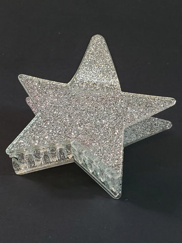 3 1/2” claw style clear acrylic with silver glitter hair clip in the shape of a pointy star
