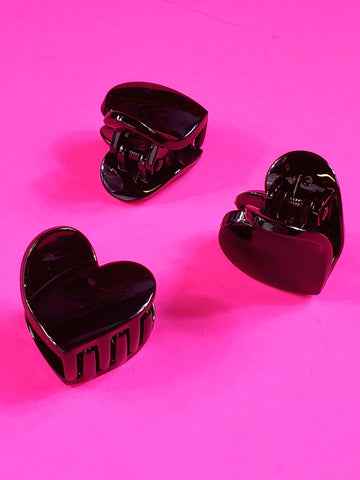 glossy plastic heart shaped claw-style hair clip in shiny black, showing three different views