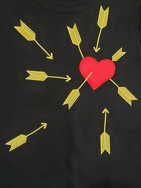black short sleeve pullover sweater from Astro Bettie features an appliqued bold red felt heart under attack from many bright yellow embroidered arrows, shown cropped close up of decoration