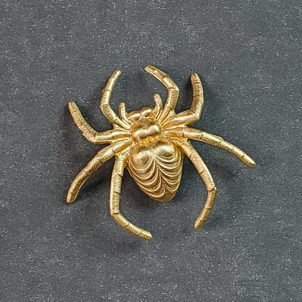 Brass spider shaped brooch with a matte bright gold finish 