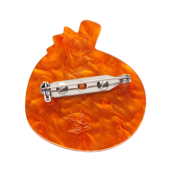 "Midnight Magic Pumpkin" layered resin mini brooch, showing solid orange back view