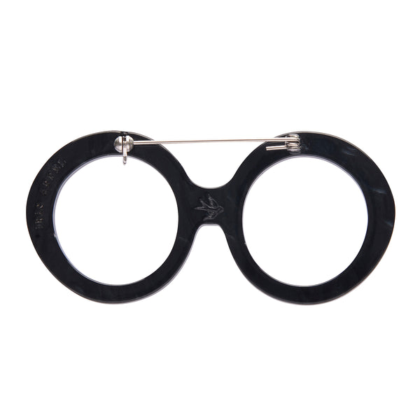 Iris Apfel x Erstwilder collaboration collection "I Wear Eyewear Iris" layered acrylic resin pair of black round frame spectacles brooch, showing back view
