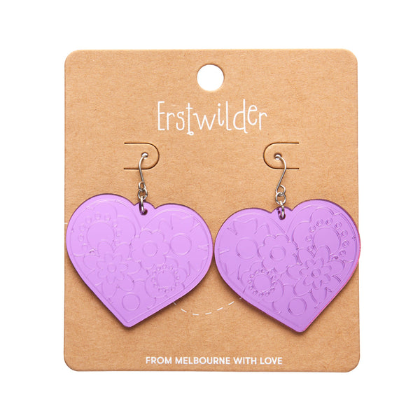pair Spellbound Essentials Collection "Love Heart" dangle earrings in shiny etched mirror finish purple 100% Acrylic resin, shown on branded backer card packaging