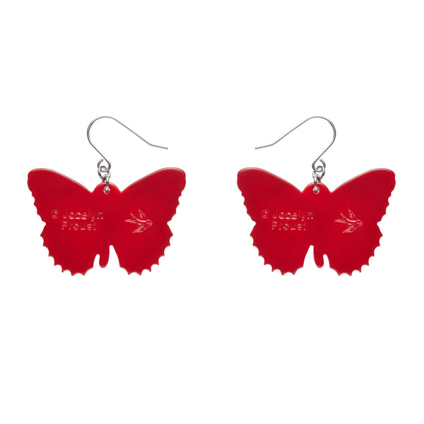 Jocelyn Proust Collaboration Collection "Wings Laced in Red" layered resin butterfly dangle earrings, showing solid red reverse