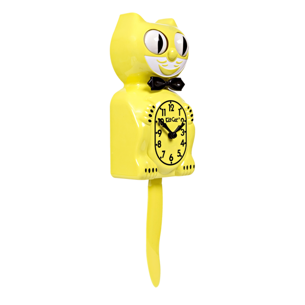 Bright yellow and white Kit-Cat wall mount clock features a mischievous grin, and big round eyes that swivel side-to-side in time with its pendulum tail