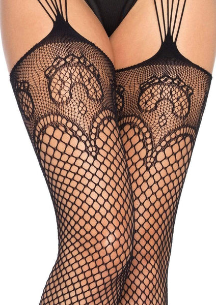 Black industrial fishnet stockings with lace net tops, solid toe and attached fishnet garterbelt, shown on model