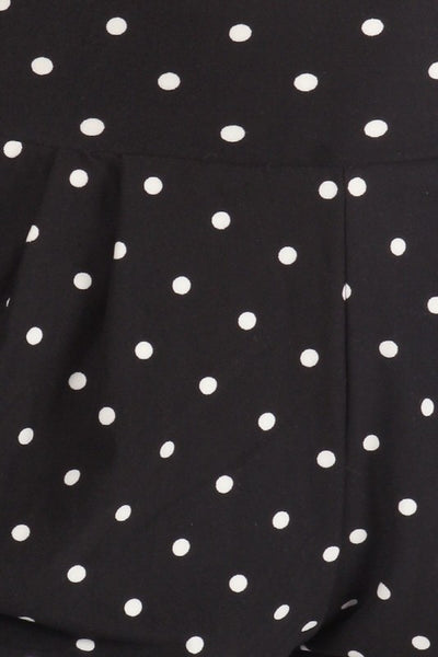black with white polka dot print brushed fiber knit relaxed fit high waist shorts with elastic waist band, pleated front, ruched side seam detail, and pockets, showing fabric swatch close up detail