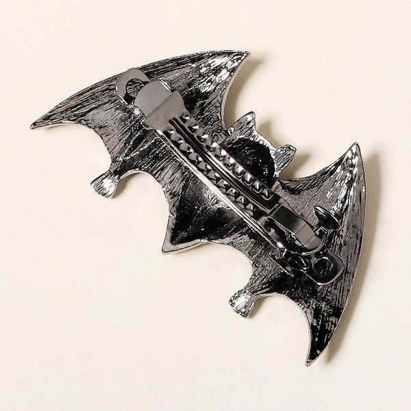 2 5/8" gunmetal finish bat-shaped barrette encrusted with black and clear faceted "rhinestone" jewels on sturdy 2" long pinch release clip fastener, shown back view
