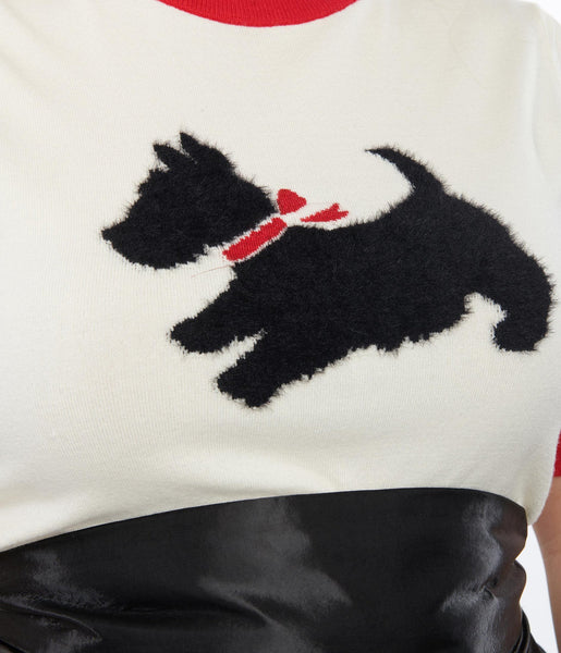 cream colored sweater with contrast red band finish at the crew neck and short puffed sleeves, 3-button closure at the nape, and fuzzy knit-in Scottie Dog with red bow, shown close up on model