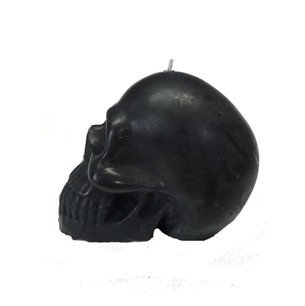 4” tall black skull-shaped candle that “bleeds” red wax when lit. Shown unlit from the side