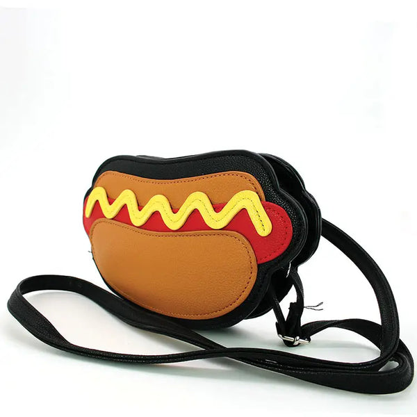 Novelty purse in the shape of a hot dog with a black crossbody strap. Shot shows crossbody strap connected to exterior of purse